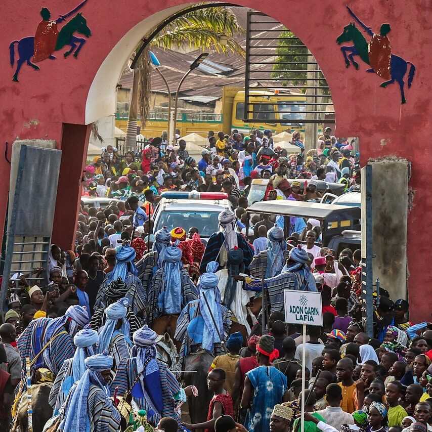 a large group of people standing in front of a building