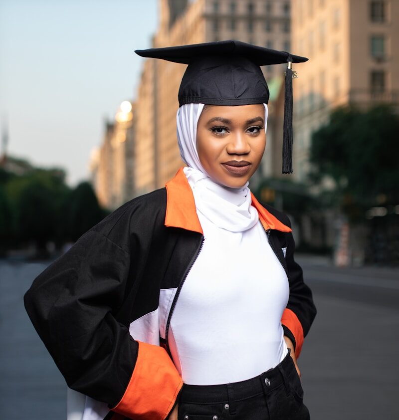 a woman in a graduation cap and gown